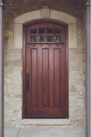 Tops of exposed beams are capped. Wood Front Door Highlights Rich Craftsman Details Pella