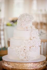 For more wedding arch ideas, take a peek at these inspirational arches. White Wedding Cake With Cascading Sugar Flowers