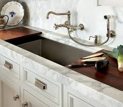 Unlike traditional faucets, wall mounted faucets extend straight from the wall above the sink so that the water flows over the vanity or countertop. Pin By Kara Owens On In The Details Kitchen Kitchen Faucet With Sprayer Wall Mount Kitchen Faucet Vintage Kitchen Faucet