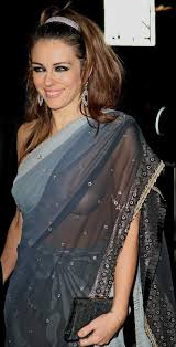 The actress, 55, reposted the photos on her twitter feed, after piers morgan accused her of being 'thirsty and creepy' and getting her son damian, 18, to photograph. Elizabeth Hurley Wither Her Husband Arun Nayar Attending The Love Ball At The Roundhouse In London England On February 23 2010 Famousfix Com Post