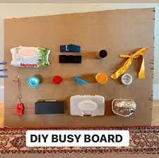 Need A Few Minutes Of Silence This Cardboard Diy Busy Board Will Do The Trick Keep Your Toddler Entertained Wit Diy Busy Board Busy Board Toddler Activities