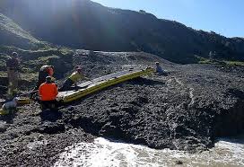 woman stuck chest deep in mud rescuing