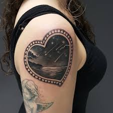 This poor man's heart is in the hands of a harpy and who knows what she'll do with it. 61 Best Heart Tattoos Design And Ideas