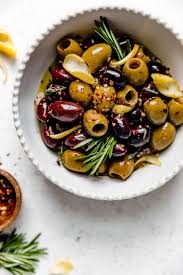 Easy Marinated Olives 7 Simple Ingredients Plays Well With Butter Recipe Marinated Olives Olive Recipes Healthy Finger Foods