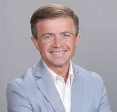 Who has the right of way when a left-turning car and a right-turning car  intersect, and what are the rules for turning into lanes?