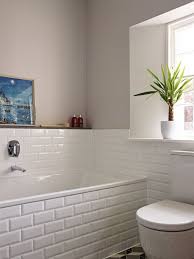 White Brick Wall Tiles Have Been Continued Around The Side Of The Bath Which Keeps The Design Of This Family Bathroom Design Bathroom Interior Bathroom Design