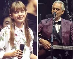 Andrea Bocelli sits on stage and introduces his 8-year-old ...