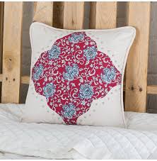 Plaids, florals, stripes — a good oriental rug. Bandero White Tooled Floral Toss Pillow