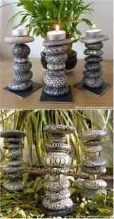 18 Creative Ideas For Painted Pebble And River Stone Crafts Outdoor Diy Projects Stone Candles Stone Candle Holder