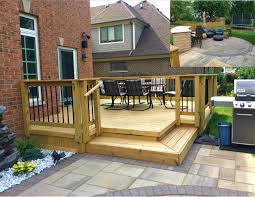 this wood deck and belgard paver patio combination were custom designed and built in glenview il by a patio pavers design diy patio pavers outdoor patio decor