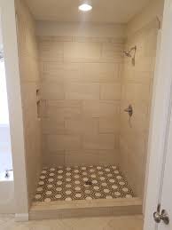 Hex Floor Tile In A Shower With A 12x24 1 2 Offset Shower Wall Small Bathroom Tiles Shower Tile Bathroom Floor Tiles