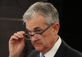 U.S. stocks close mixed after Fed cuts rates but casts doubt