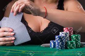 Sexy Woman In Black Underwear With Big Boobs Playing Poker Game At The  Table Stock Photo, Picture and Royalty Free Image. Image 87674132.