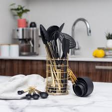 This eclectic kitchen used black subway tiles and countertops to add a certain darkness to the cooking space. Gold Black Nylon Utensils With Holder 16 Pcs Styled Settings