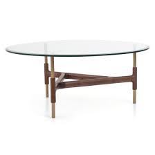 Placed on top of a metal base with a gold finish, this table has a sturdy, contemporary look that stands out. Edison Wood Coffee Table For The Living Room Mobilia Canada