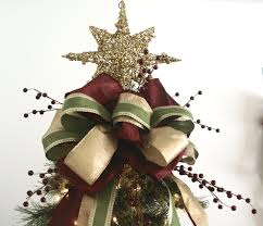 You can never go wrong with a tree topper bow. The Gathering Place Design Company Christmas Tree Star Topper Christmas Tree Bows Christmas Tree Toppers