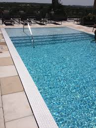 Water Level That Is Even With The Pool Deck Has A Modern Feel And Is Great So You Can Sit On The Edge Of The Pool To Socia Backyard Pool Pool