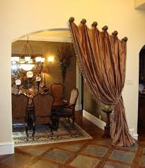This is the room where luxury lives and where using a lot of fabric isn't a shame. Curtain On Arched Doorway Hmm Dining Design Home Tuscan Decorating