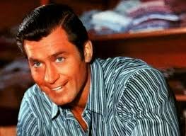 A smiling Clint Walker shopping in 1 of his favorite stores