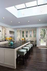 The wooden floors are a rich dark color, with natural texture and hues. Dark Wood Floors Contemporary Kitchen Home Beautiful Kitchens