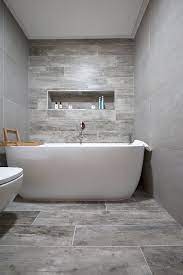 It can withstand moisture and a high amount of foot traffic making it ideal for bathrooms. Rockpool Grey Wood Effect Porcelain Porcelain Tiles Mystonefloor
