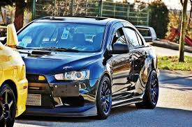 Subaru Impreza Wrx Sti Vs Mitsubishi Lancer Evolution X Mitsubishi Evo X Visit S At Www Rvinyl Com To See 100s Of Great Tuner Accessories And Get The Jd Mitsubishi Lancer Mitsubishi Lancer Evolution Mitsubishi Evo