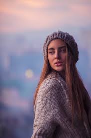 Find the look that complements your features! Young Beautiful Woman With Blue Eyes And Long Brown Hair Outside The City At Sunset By Maja Topcagic