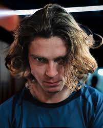 Just a joke in the @copperboxarena corridor. @jimchardy walks through the  players' lounge, grabs the photographer's camera, and takes a close  portrait of @andreyrublev. The photographer captures the moment with his old