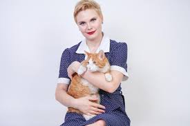 Easy half up hairstyle tutorial. Cute Kind Woman With Short Hair In Pinup Polka Dot Dress Holding Her Beloved Pet On A White Background In The Studio Plus Size Ad Stock Photo Image Of Enjoy Kiss