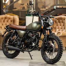 The Green 125cc Mutt Hilts At Garagemcentralporto Muttmotorcycles Mutt Motorcycle Muttlife Cafe Racer Bikes Cafe Racer Motorcycle Cafe Racer Moto