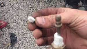 How does spark plug porcelain break glass? Spark Plug Porcelain Thrown At A Window Youtube