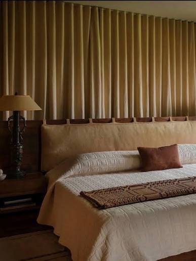 My argument for curtains behind your bed… Curtains don't have to be reserved for windows. In a space like a bedroom, where soft furnishings are such a focal point for comfort, texture