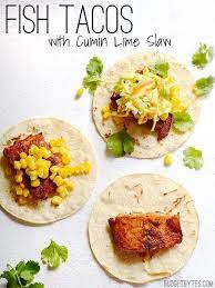 To assemble the grilled fish tacos, place several pieces of fish and some grilled chilies atop 2 stacked warm corn tortillas. Facebook