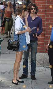 The arctic monkeys are maybe,. Photos And Pictures Nyc 07 26 09 Alexa Chung Of Mtvs It S On With Alexa Chung Her Boyfriend Alex Turner From The Arctic Monkeys And Her Parents Stopping To Get A Polaroid Family