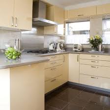 The cabinets are made with a traditional farmhouse structure in mind, but their painted grey cabinets, white stone countertops, and subway tile backsplash keep the look fresh. Modern Cream Kitchen Kitchens Kitchen Ideas Image Ideal Home Grey Kitchen Floor Modern Kitchen Cream And Grey Kitchen