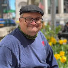 A group of American soldiers bow their heads as Chaplain 1st Lt. Harvey  Floyd Bell says grace prior to eating Christmas dinner near the Italian  front. Photo taken