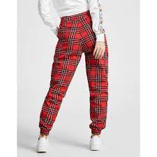 These pants can be found in vibrant shades such as orange and red or neutral tones like black, white and olive green. Ellesse Cotton Cargo Pants In Red Black White Red Lyst