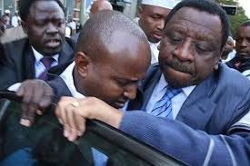 Undated photo of Orengo fiercely protecting Junet Mohammed from arrest by  police officers after a TV interview