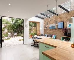 A butcher block countertop is a good option if you like the variety of color tones found in wood. 75 Beautiful Kitchen With Green Cabinets And Wood Countertops Pictures Ideas July 2021 Houzz