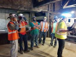 Team Checking Out The Halo Light Hard Hat Halo Light