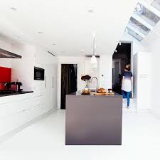 Dark hardwood floors contrast against the walls, while a. White Vinyl Flooring The Colour Flooring Company