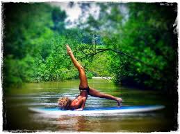 Nosara Sup Yoga Nosara S Yoga On The Stand Up Paddleboard Paddle Board Yoga Yoga Meditation Retreat Yoga Retreat