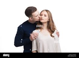 Portrait of woman being kissed by her boyfriend Stock Photo - Alamy