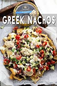 Greek Nachos With Savory Ground Beef Or Lamb Creamy Hummus Rich Whipped Feta Yogurt Sauce And Fresh Toppings Lik Greek Nachos Greek Appetizers Greek Recipes