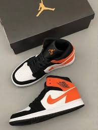 Black And Orange Air Jordan 1 Mid Nike Air Jordan 1 Mid White Black Orange 554724 058 Unisex Basketball Shoes In 2020 Nike Air Jordan Shoes Air Jordans White Nike Basketball Shoes