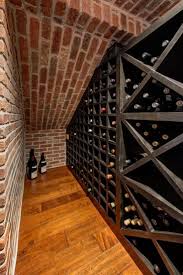 Basement Wine Cellar With Exposed Red Brick Wall Wine Cellar Basement Home Wine Cellars Under Stairs Wine Cellar