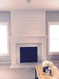 The black gas fireplace is a functional but beautiful part of the white shiplap wall. Found On Bing From Savillerowmusic Com Shiplap Fireplace Fireplace Wall Fireplace Surround Diy