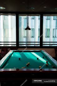 Maybe you would like to learn more about one of these? A Billiard Table In A Room Of An Office Building Dark Wooden Stock Photo 191387544