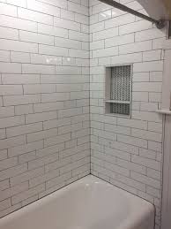 White Tile With Dark Grout In The Bathroom Thin Grout Lines Are Key So Much Work Still Needs To Be Done Bathtu Shower Alcove Shower Niche Upstairs Bathrooms