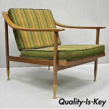 Danish armchairs are built for comfort despite their highly stylized designs, with many models featuring an ergonomic backrest and thickly padded seat. Vintage Mid Century Danish Modern Metal Frame Walnut Lounge Arm Club Chair Ebay